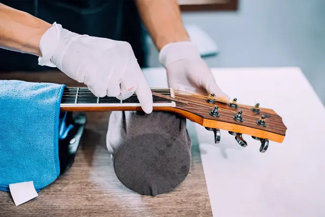 Acoustic%20guitar%20repairman%2C%20Fixin