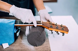 Acoustic%20guitar%20repairman%2C%20Fixin