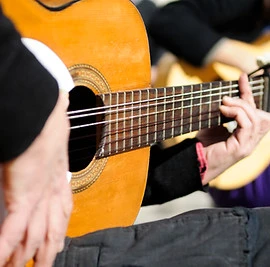 Man playing the Spanish guitar.jpg
