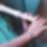 Boy fingers playing flute at home for his music class assignment. Child art activities und