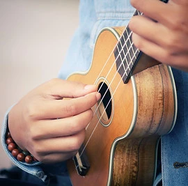 woman playing ukulele.jpg