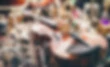 Close up of violin, luthier workshop in background.jpg