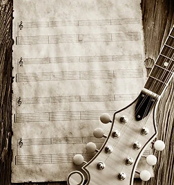 old blank music sheet with mandolin peg head, sepia picture.jpg