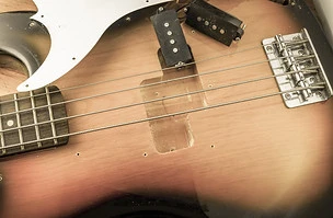 Repairing electric bass with vintage look effect..jpg