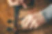 Luthier repair violin in his workshop_edited_edited.jpg