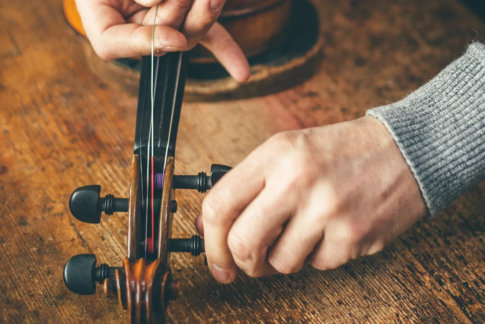 Luthier repair violin in his workshop_edited_edited.jpg